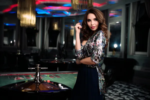 KOKOZINO Jackpot Slots — Spin for massive rewards A dramatic shot of winning sevens landing on a slot reel surrounded by shining gold coins, symbolizing big wins.